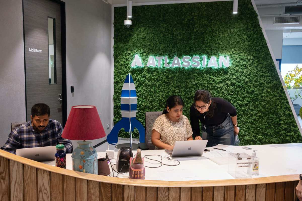 Signage for Atlassian Corp. is displayed in the enterprise software company's Global R&D Center in Bengaluru, India, on Wednesday, July 3, 2019. Atlassian Co-founder and Chief Executive Officer Cannon-Brookes has said the firm will get all its power from renewable sources by 2025. Photographer: Karen Dias/Bloomberg