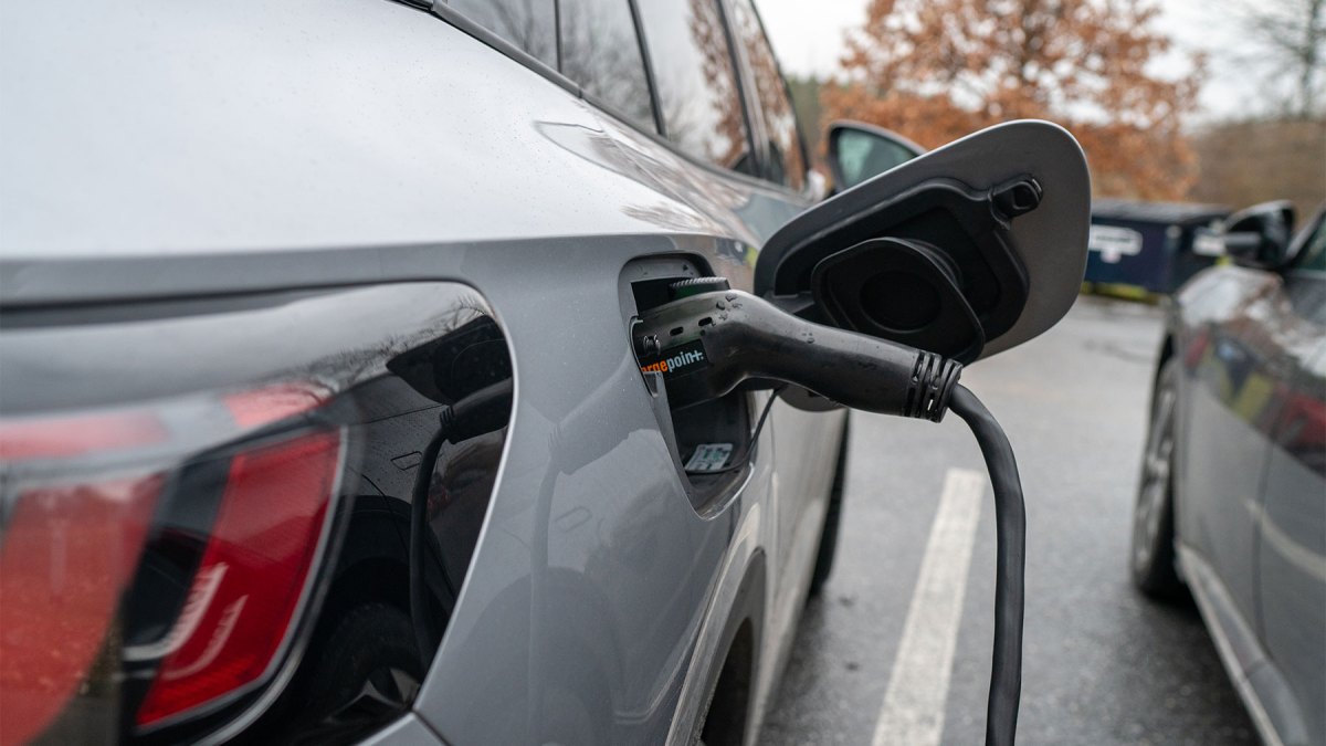 A Volkswagen ID.4 electric car recharges its batteries November 14, 2023 at a charging station next to the town hall in Charlotte, Vermont.